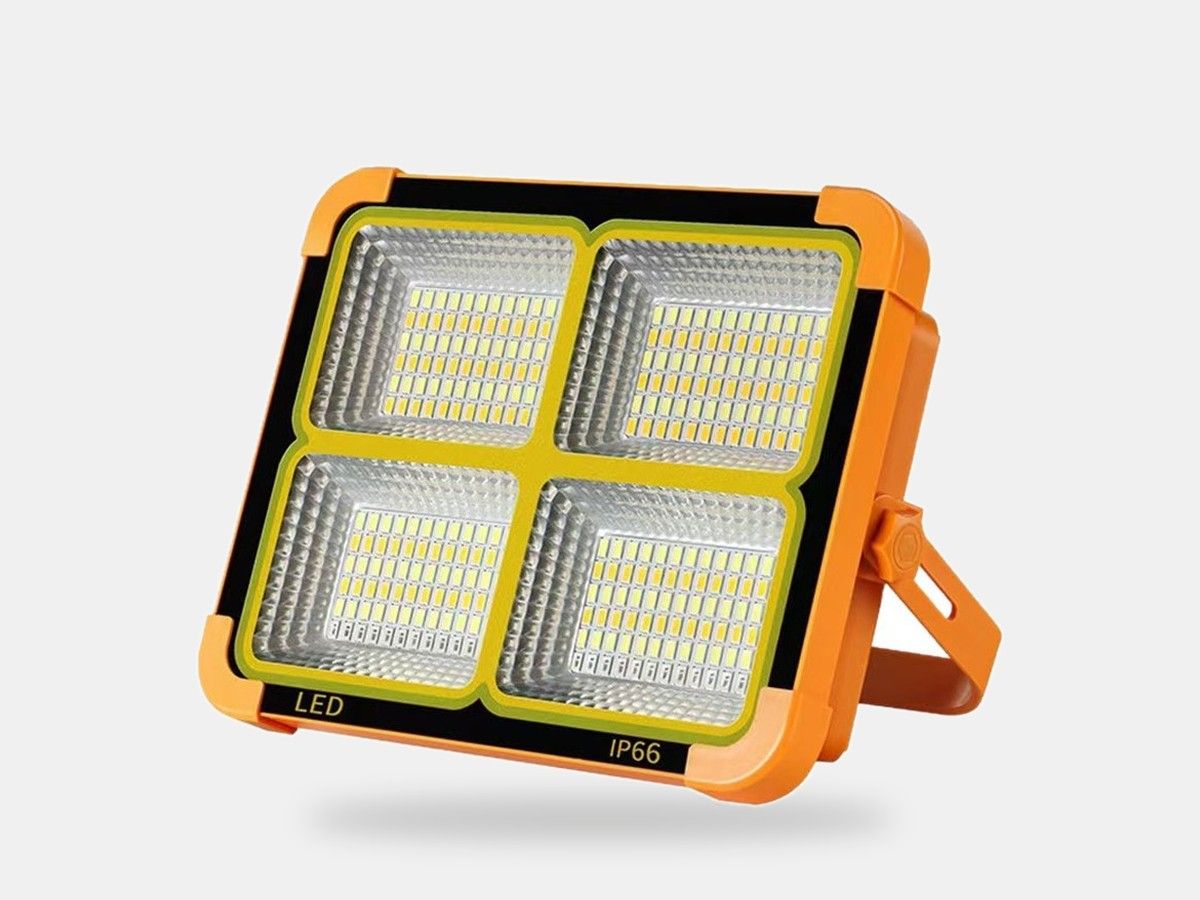 Portable solar rechargeable LED light with folding carry handle